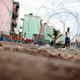 In this May 30, 2010, file photo, a girl walks behind a concertina wire at a military checkpoint in the Tivoli Gardens neighborhood of Kingston, Jamaica, during a state of emergency on the Caribbean island. (Rodrigo Abd, file/AP Images)